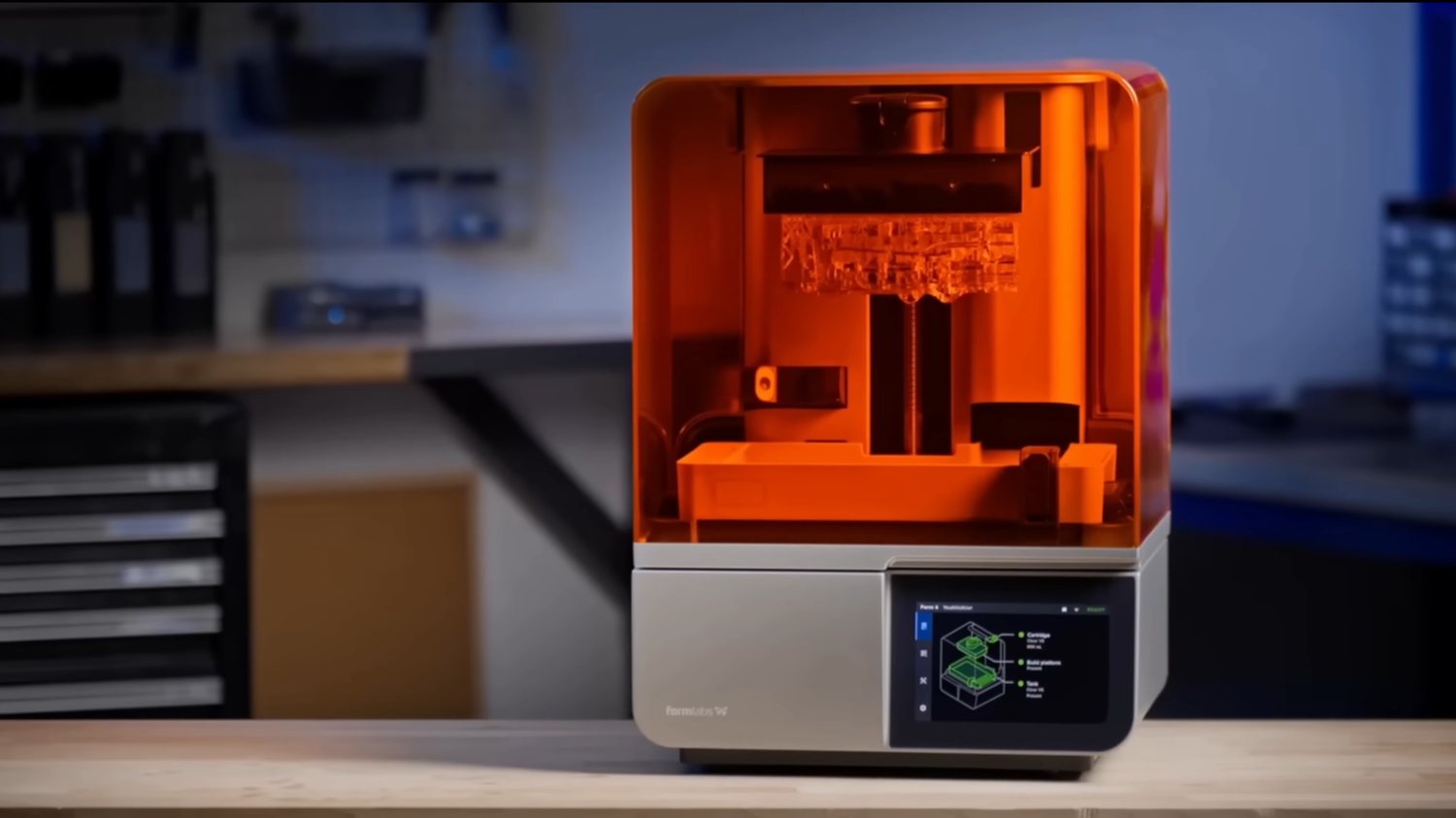 Custom acrylic enclosure housing an industrial 3D printer