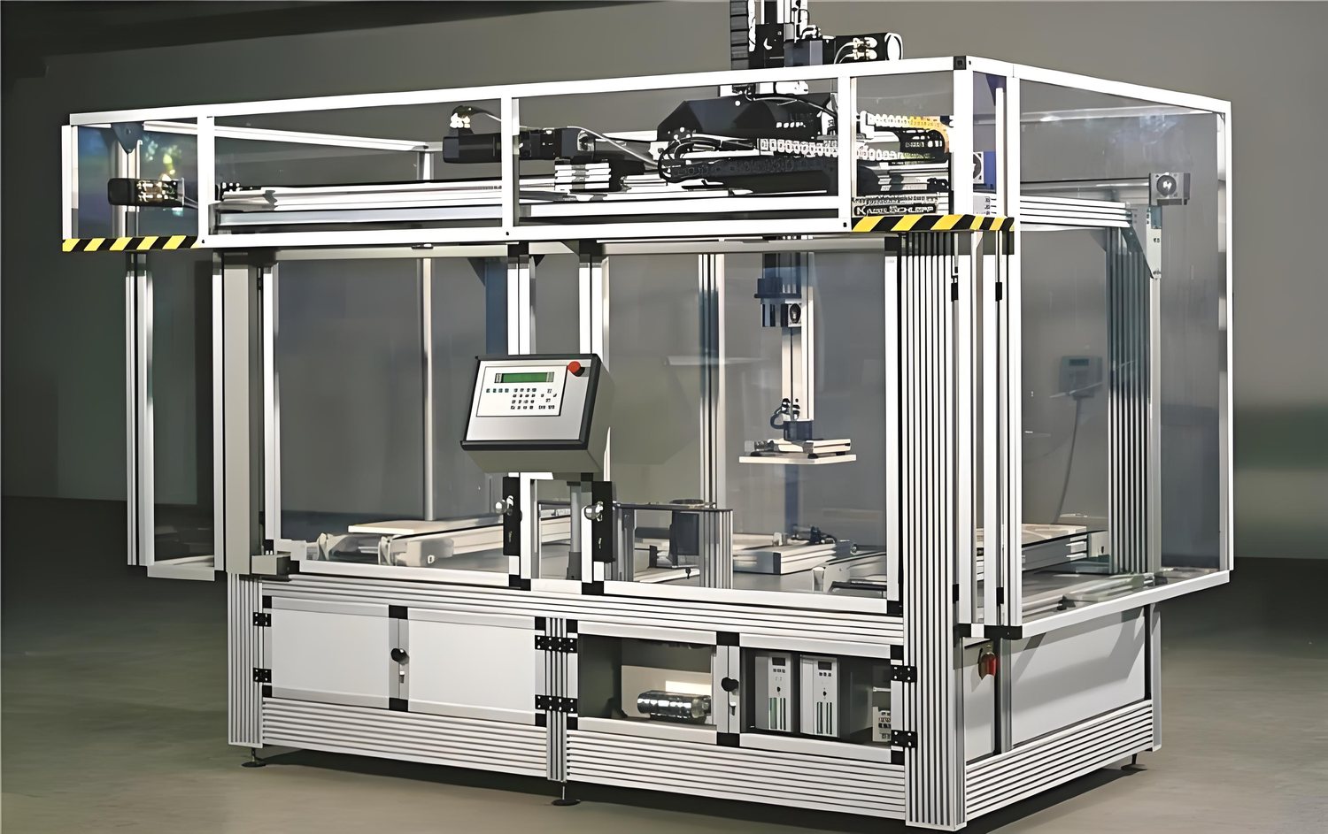 Custom acrylic machine enclosure with safety framing on automation equipment