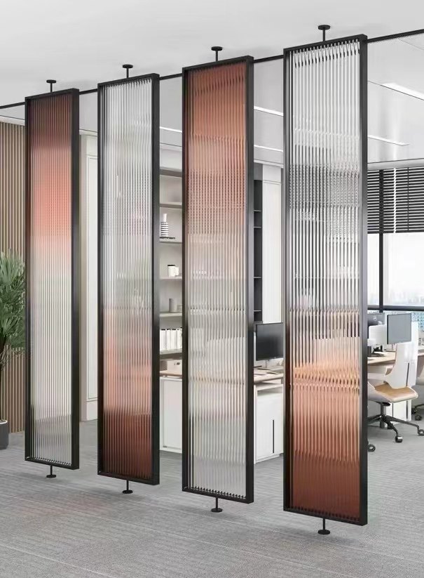 Fluted acrylic partition screens dividing an open-plan office