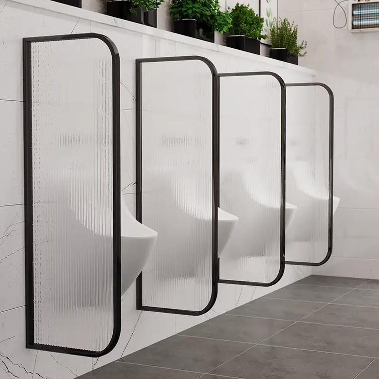 Framed fluted acrylic partition panels mounted along a wall