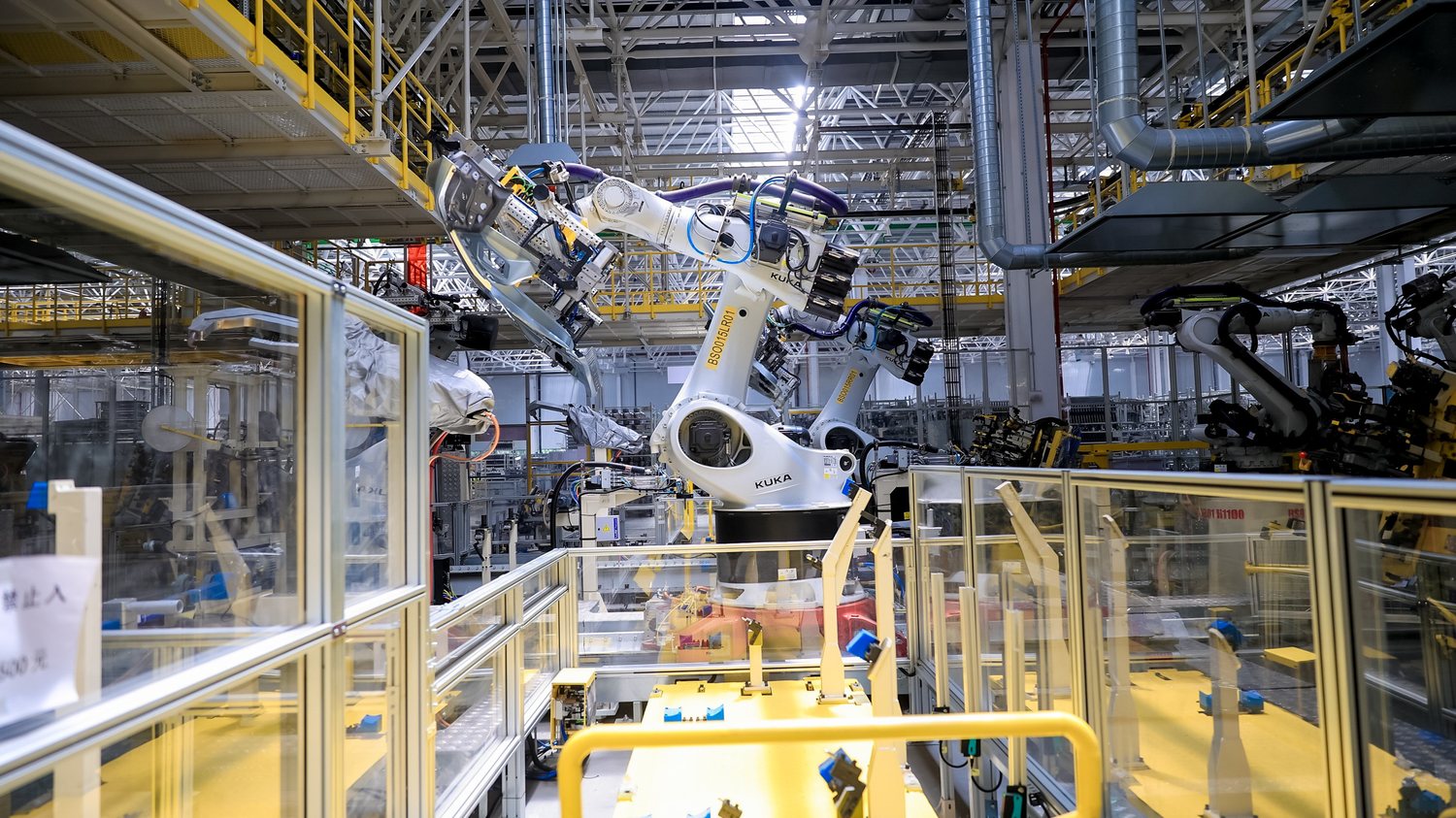 Clear acrylic guarding around an industrial robot cell