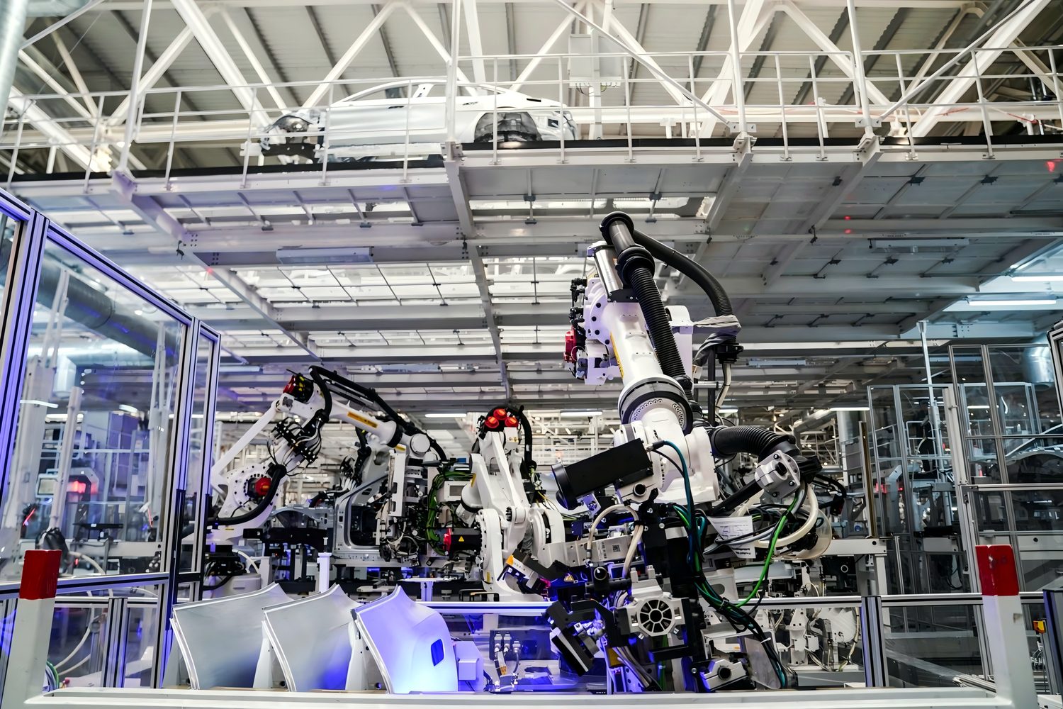 Clear acrylic guarding panels enclosing an industrial robot cell