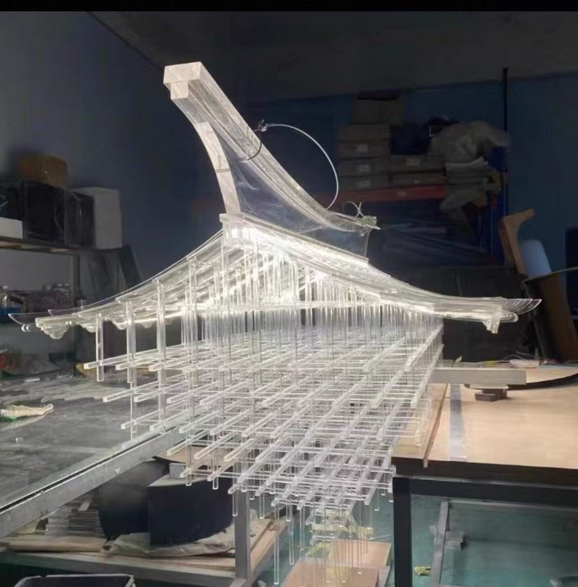 Large custom acrylic rod chandelier installation in an atrium
