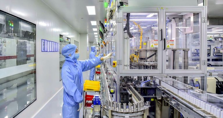 Clear acrylic viewing windows on an EV battery production line