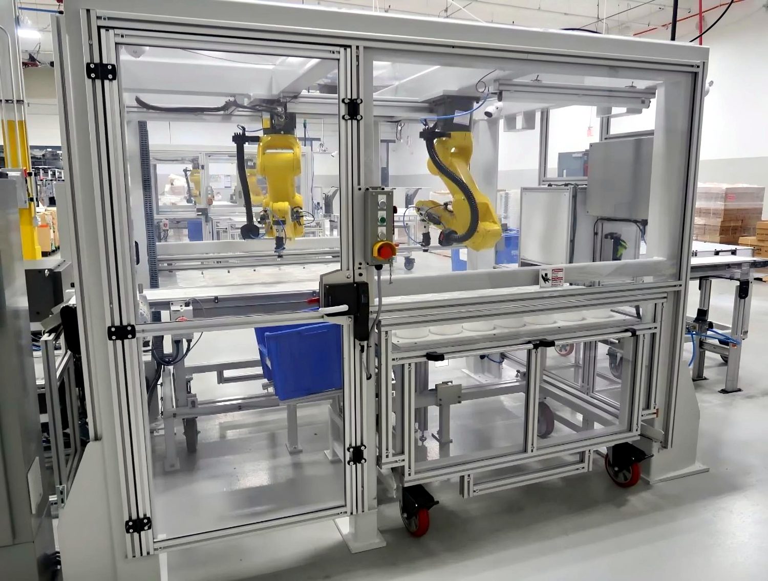 Aluminium-framed acrylic machine guards around a robot cell