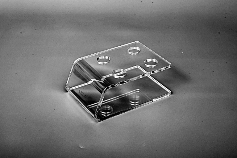 Machined cast acrylic bracket with polished edges