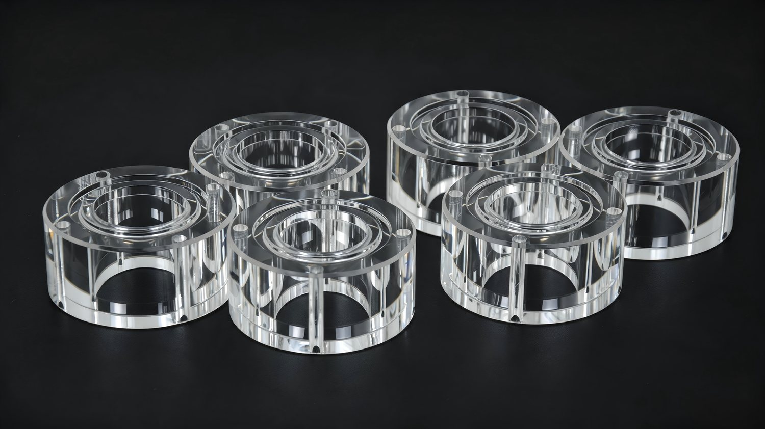 CNC-machined clear acrylic rings and bearing housings