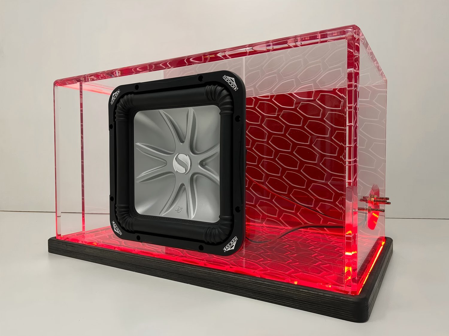 Custom clear acrylic equipment enclosure with red frame and fan