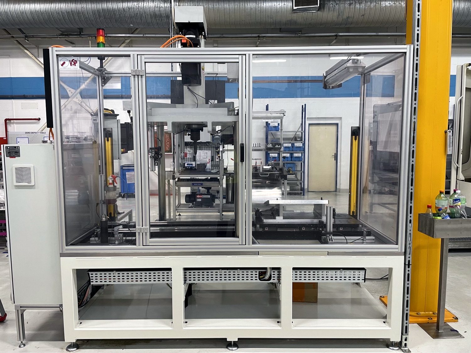Framed acrylic guard enclosure on industrial machinery
