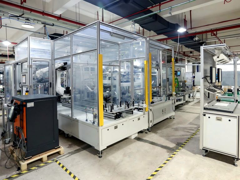 Large clear acrylic panels enclosing an automation cell