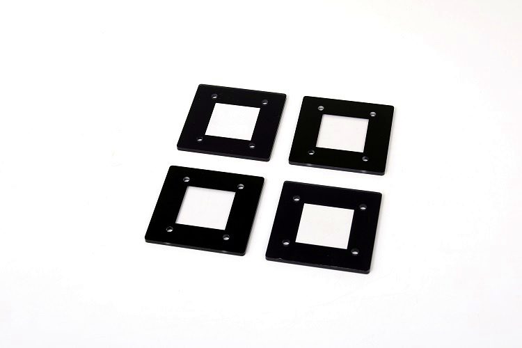 Laser-cut black acrylic gaskets with clean square apertures