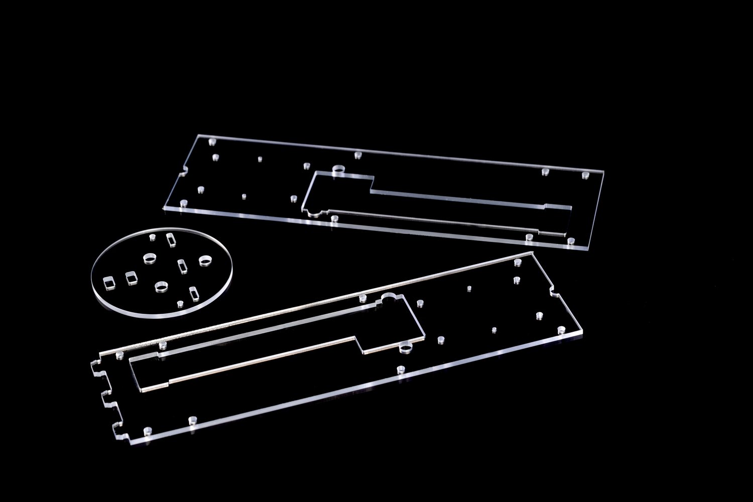 CNC-machined acrylic panel with milled channels and pockets